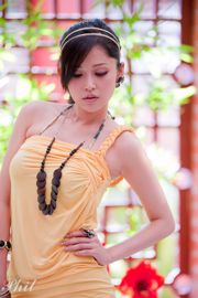 Leg model Avy Du Kewei, "Outside Shooting in Yellow Sling Miniskirt"